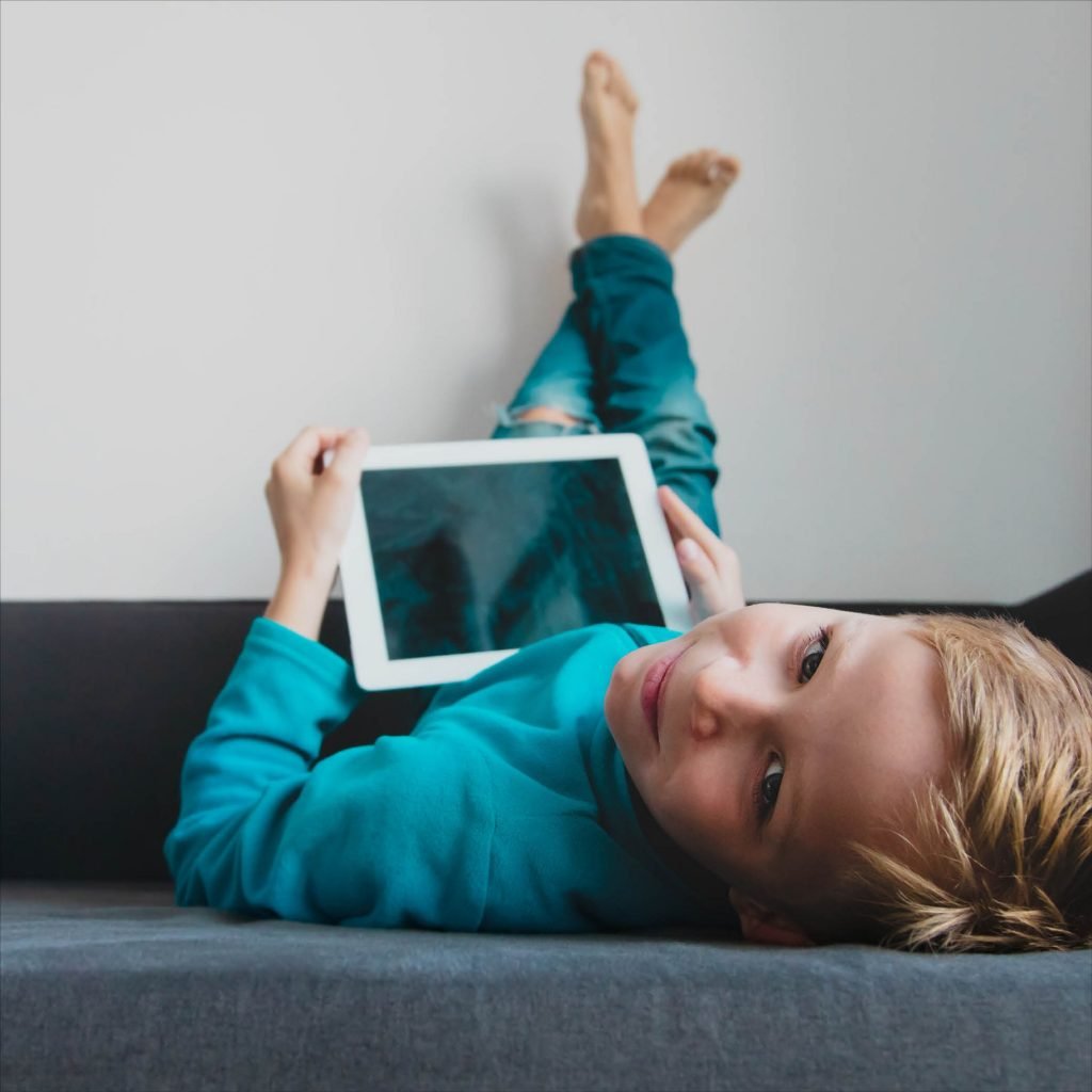 A child using technology for online story time.