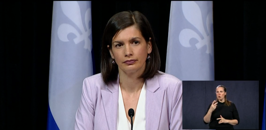 Quebec Deputy Premier Genevieve Guilbault listens to a reporter asking a question during coronavirus (COVID-19) emergency press briefing.