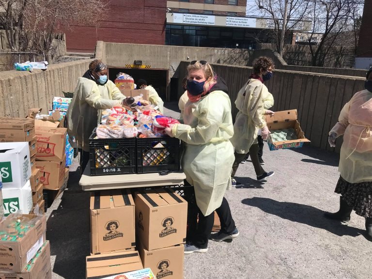 Guiliana Fumagalli, mayor of Villeray-Saint-Michel-Parc-Extension borough assisting volunteers at PEYO and Afrique du Feminin.